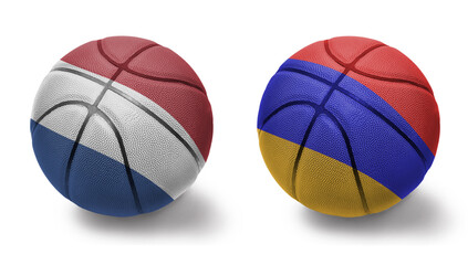 basketball balls with the national flags of armenia and netherlands on the white background.