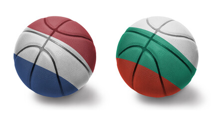 basketball balls with the national flags of bulgaria and netherlands on the white background.