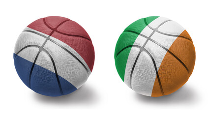 Obraz premium basketball balls with the national flags of ireland and netherlands on the white background.