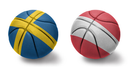 basketball balls with the national flags of austria and sweden on the white background.
