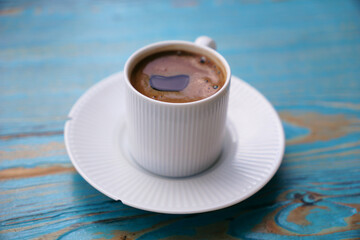 Turkish coffee in a white cup. Coffee for breakfast