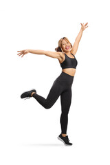 Obraz premium Active young filipina woman in sports clothes showing excitement