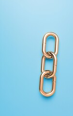 Gold metal chain links on a vibrant blue background, minimalistic design.