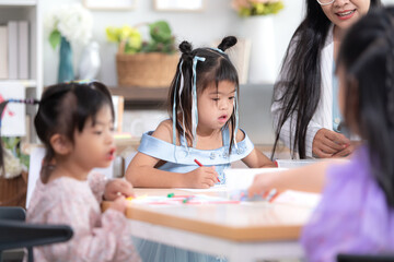 A group of special students doing learning activities in a special classroom