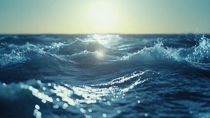 Obraz premium Ocean waves at sunrise with sparkling sunlight reflections