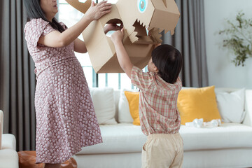A special child with his favorite dinosaur figure, having fun in the living room of the house
