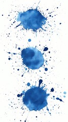 Three abstract blue watercolor splatter shapes isolated on a white background.