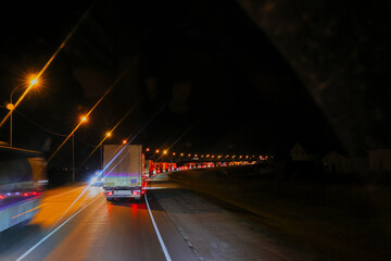 Rows of cars stuck in traffic on the highway, mostly trucks