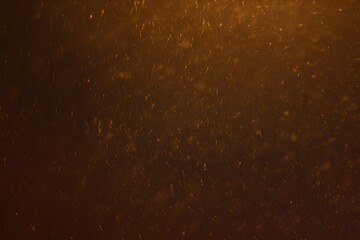 Abstract Snowstorm texture. Falling snow. Light flashes and bokeh. Sun rays. Lens flare. For use as texture layer to add falling snow any image.