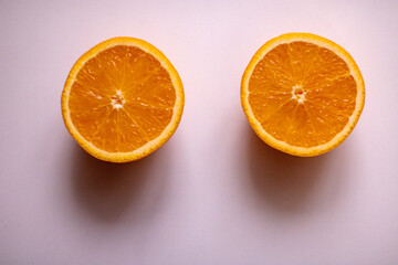 oranges on a pink table