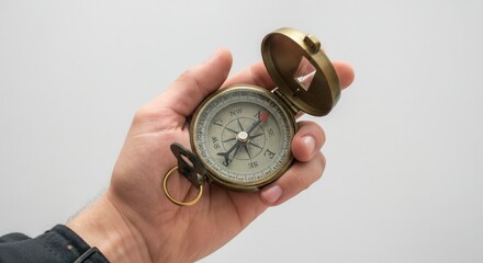 Close-up of hand holding vintage compass