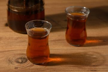 Warm cups of aromatic tea on a rustic wooden table in a cozy setting during the afternoon
