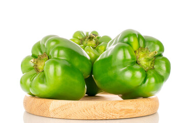 Sweet green capsicum on wooden tray, macro, isolated on white background.