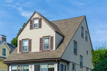 Traditional gable-roofed house with brown trim and shutters in Brighton, Massachusetts, USA