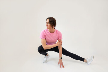 Sporty young woman make relax yoga exercise  isolated on white background