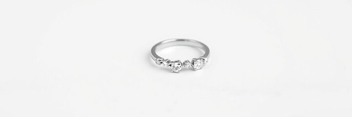 Dainty silver ring featuring a scattering of isolated diamonds on a white background, minimalist rings, subtle sparkle