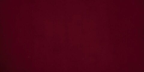 Vintage burgundy velvet fabric texture background with subtle sheen, reddish, crimson