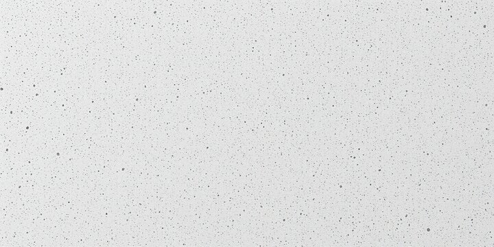 Close-up of light gray microcement with a subtle, speckled texture resembling small stones or pebbles, speckled texture, gray tone