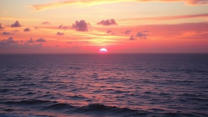 Fototapeta premium Vibrant oranges and pinks fill the sky as a breathtaking sunset meets the ocean, sun, colors, sky