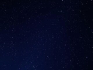 Fototapeta premium A starry night sky with a laser light effect overlay in shades of blue and silver, starry night sky, illumination