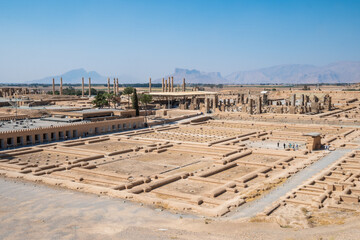 Persepolis, beautiful stone archway stands tall with a blue sky, Iran © Leo Viktorov