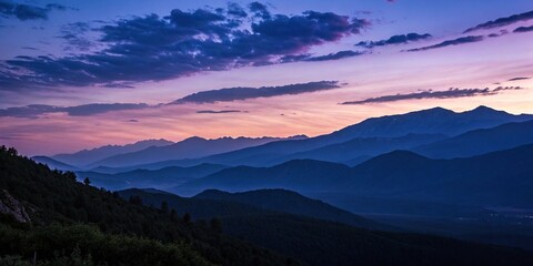 Fototapeta premium A dark purple blue gradient of the sky at sunset over a mountain range, bluedeviation, outdoorphotography, mountainskies, darkpurple, sunsets