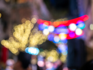 Blurring out of focus bokeh light from light bulb in decoration alley, for background