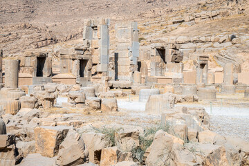 Persepolis, beautiful stone archway stands tall with a blue sky, Iran