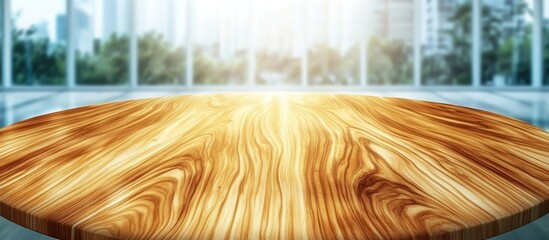 Beautiful round wooden tabletop in a clean bright kitchen interior ideal for product displays and montages