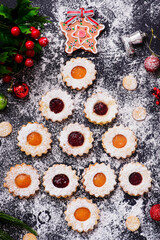 Traditional Christmas Linzer Cookies on a Christmas rustic background