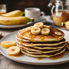 A plate of banana pancakes topped with slices of banana and honey, set on a cozy breakfast table.