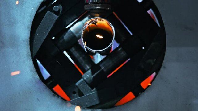 Slow motion video of laser cutting machine cutting metal