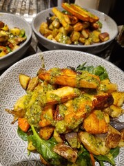 Homemade halloumi and potato dish with basil pesto drizzle sauce