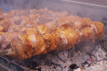 Kebabs on skewers are grilled on hot coals