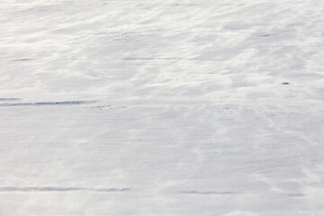 The snow is white and the ground is covered in it