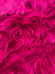A close up of a pink fur texture