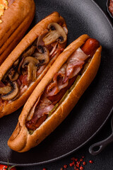 Hotdog with grilled sausage with bacon and mushrooms