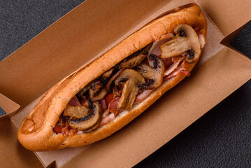 Hotdog with grilled sausage with bacon and mushrooms