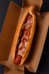 Hotdog with grilled sausage with bacon and mushrooms