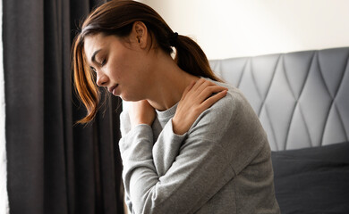 Unhappy lonely depressed woman is sitting on the bedroom, depression concept