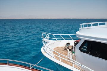 Boat deck. Wide angle view of the yacht front opposite blue sea