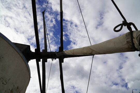 Traditional old Portuguese windmill near the N125 national road near Budens, Portugal. View of the rotor blades against the blue sky of the Portuguese Algarve region.