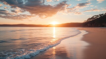 Naklejka premium Serene beach scene with the sun low in the sky and soft waves