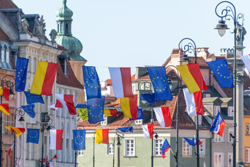 Flags of Poland, Warsaw and the European Union. Festive decorations in the Old Town. Warsaw