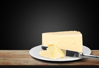 Fresh butter placed on plate. Breakfast time