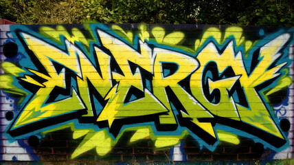 Vibrant graffiti artwork featuring the word 'ENERGY' in bold yellow and green hues, showcasing...