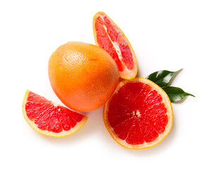Cut fresh grapefruits and leaves on white background