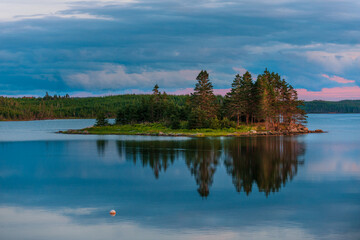Brackish water Bras D'Or lake at sunset near Baddeck, Cape Breton, Nova Scotia, Canada