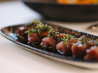 a plate of tuna sashimi