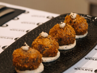 a plate of croquettes in a restaurant